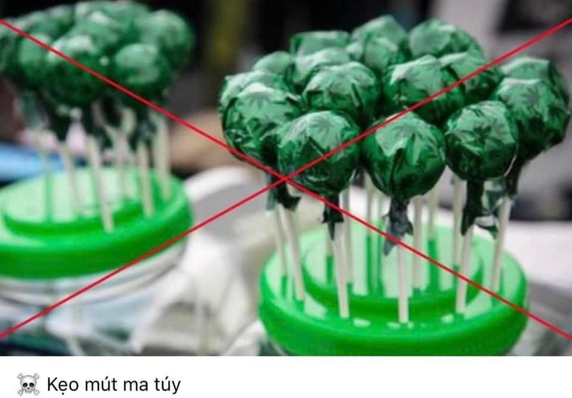 A group of lollipops in a green container

Description automatically generated
